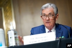 FILE - Chairman of the Federal Reserve Jerome Powell speaks during a Senate Banking Committee hearing on Capitol Hill in Washington, Dec. 1, 2020.