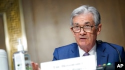 FILE - Chairman of the Federal Reserve Jerome Powell speaks during a Senate Banking Committee hearing on Capitol Hill in Washington, Dec. 1, 2020.