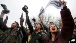 Relatives and colleagues of a team of kidnapped journalists from El Comercio protest outside Carondelet Palace to demand action from the government in Quito, Ecuador, April 2, 2018.