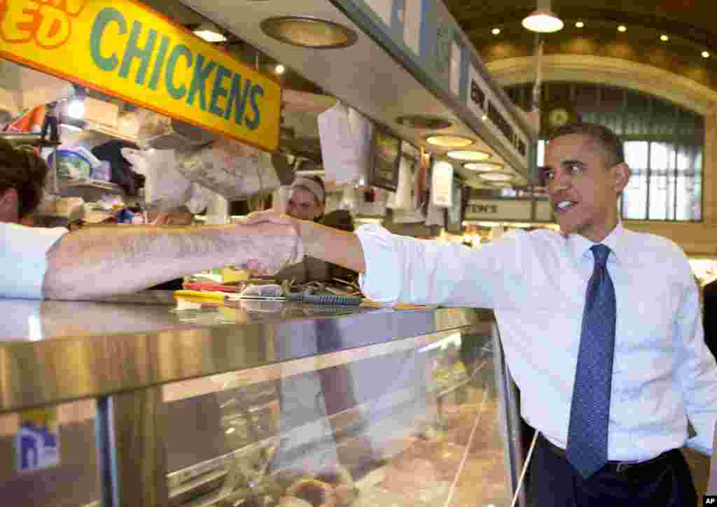 President Barack Obama greets people at West Side Market in Cleveland, Ohio, Oct. 5, 2012. 