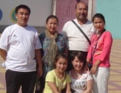 FILE - Ghopur Hapiz, back row 2nd right, and Fatima Abdulghafur, front row 2nd left, are seen in Kashgar city in Xinjiang in this undated photo. (Photo courtesy: Fatima Abdulghafur)