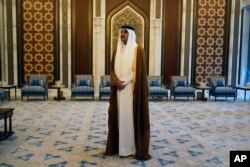FILE - Qatari Emir Sheikh Tamim bin Hamad Al Thani waits for the arrival of U.S. Secretary of State Antony Blinken in Lusail, Qatar, Friday Oct. 13, 2023.