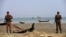 FILE - Members of Border Guard Bangladesh (BGB) stand guard on the bank of Naf River near the Bangladesh-Myanmar border to prevent Rohingya refugees from illegal border crossing, in Teknaf near Cox’s Bazar, Bangladesh, Nov. 22, 2016. 