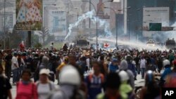 Security forces spray demonstrators with water canons during an anti-government protest demanding Venezuelan President Nicolas Maduro open a so-called humanitarian corridor for the delivery of medicine and food aid, in Caracas, Venezuela, May 22, 2017.