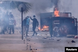 Supporters of Senegal opposition leader Ousmane Sonko clash with security forces ahead of their leader's court appearance for a libel case against him in Dakar, Senegal, March 16, 2023.