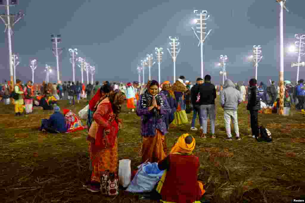 Devotees gather on the day they take a holy dip at Sangam, the confluence of the Ganges, Yamuna and Saraswati rivers, during the &quot;Maha Kumbh Mela&quot;, or the Great Pitcher Festival, in Prayagraj, India, Jan. 13, 2025.