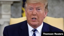 U.S. President Donald Trump speaks during a meeting with Canada's Prime Minister Justin Trudeau in the Oval Office of the White House in Washington, June 20, 2019. 