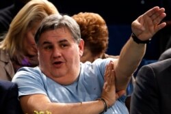 FILE - French sports journalist Pierre Menes attends the Paris Masters men's singles tennis tournament at the Palais Omnisports of Bercy in Paris, Oct. 31, 2013.