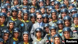 FILE - Egyptian President Abdel Fattah al-Sisi (C) is photographed with students and Air Force Academy graduates at the Air Force Academy in Cairo, Egypt, July 20, 2016.