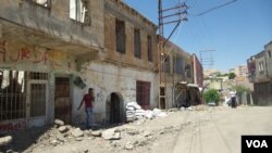 Wêneyeke arşîvê ji malwêranîya Farqînê