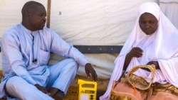 Abdulhamid Bala sits with his wife at Bakassi refugee camp. He's concerned about his father and younger brother who went missing about five years ago, in Maiduguri, Nigeria. (Courtesy - Simpa Samson)