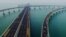 This photo shows participants crossing the Jiaozhou Bay Bridge as they compete in the 2017 Qingdao International Marathon on the Sea in Qingdao in China's eastern Shandong province.