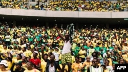 Supporters wearing T-shirts depicting South African President Cyril Ramaphosa attend the African National Congress election manifesto launch at the Moses Mabhida Stadium in Durban on Feb. 24, 2024.