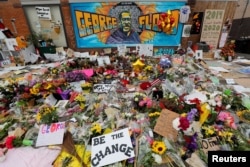 Items left by protesters to memorialize George Floyd, who died in Minneapolis police custody, are seen at the scene of his arrest in Minneapolis, Minnesota, June 4, 2020.