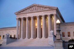FILE - The U.S. Supreme Court building at dusk on Capitol Hill in Washington.