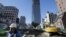 A security man stands by a road construction site in Tokyo. PM Shinzo Abe delivered a stimulus package of public works and other projects aimed at revitalizing the sagging economy, January 11, 2013.