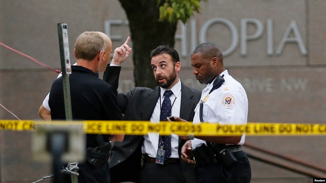 FILE - United States Secret Service police are seen standing in front of the Ethiopian Embassy in Washington Sept. 29, 2014, in connection with a shooting incident at the compound.