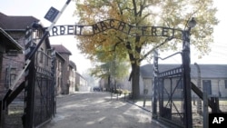 FILE - Entrance of Auschwitz at the former Nazi German death complex of Auschwitz-Birkenau in in Oswiecim, Poland.