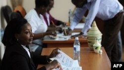 A poll clerk looks on at a polling station at the Rwandan High Commission in Nairobi, Dec. 17, 2015. Rwandans abroad were voting on Thursday in a referendum to amend the constitution to allow President Paul Kagame to rule until 2034.