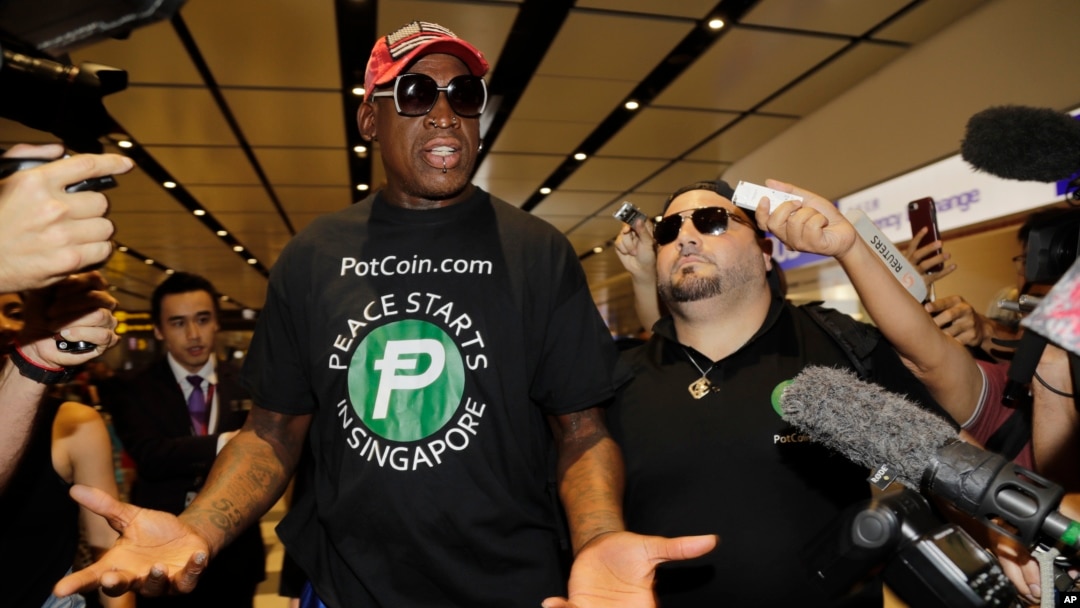 Former NBA basketball player Dennis Rodman arrives at Singapore's Changi Airport, June 12, 2018.