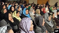 Afghan women listen to Afghan President Hamid Karzai, during a speech about women's rights, in Kabul (File)