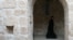 A Syriac Christian monk walks to attend a service at the ancient monastery of Mor Gabriel, 15 km from the town of Midyat, southeastern Turkey on Jan. 13, 2009.