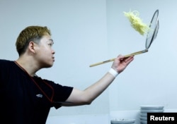 Ramen shop Menya Taisei's owner Taisei Hikage cooks ramen at his shop in Tokyo, Japan, October 22, 2024. (REUTERS/Kim Kyung-Hoon)