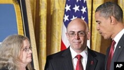 President Barack Obama presents the Medal of Honor posthumously to the parent's of US Army Staff Sgt. Robert J. Miller in the East Room of the White House, 06 Oct 2010