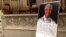 A large photo of Nelson Mandela was displayed near the main altar at the Riverside Church in New York during the late leader's memorial service, Dec. 11, 2013. (Adam Phillips/VOA)