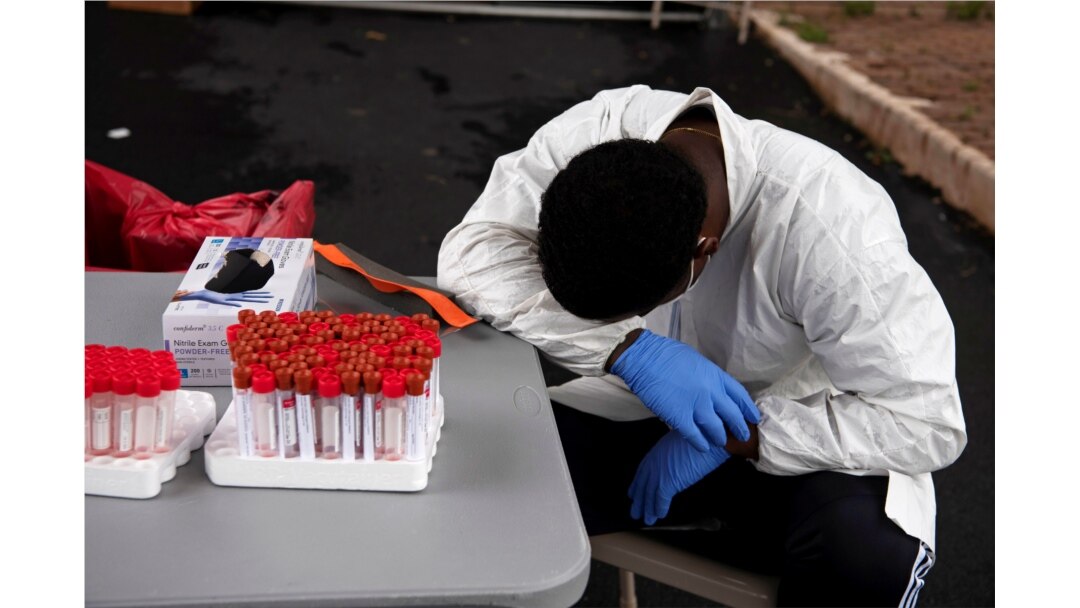 People wait in long lines for COVID-19 testing in Houston, Texas, Sep. 21, 2020.