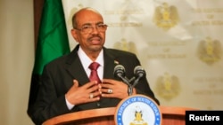 FILE - Sudan President Omar al-Bashir speaks to the media in state house in capital Juba during his visit to South Sudan, Jan. 6, 2014. 