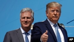 President Donald Trump and Robert O'Brien, just named as the new national security adviser, board Air Force One at Los Angeles International Airport, Sept. 18, 2019, in Los Angeles.