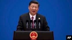 FILE - Chinese President Xi Jinping speaks during a news conference at the end of the Belt and Road Forum at the Yanqi Lake International Conference Center, north of Beijing, May 15, 2017. 