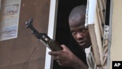 A Malian soldier looks on as junta leader captain Amadou Sanogo speaks at the Kati military camp near Bamako, April 3, 2012.