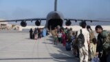 FILE - Passengers board a US Air Force C-17 Globemaster III at Hamid Karzai International Airport, Afghanistan, Aug. 24, 2021. (US Air Force Photo)