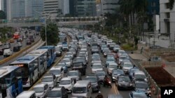 FILE - Motorists are stuck in traffic jam during a rush hour at the main business district in Jakarta, Indonesia, Dec. 11. 2018.