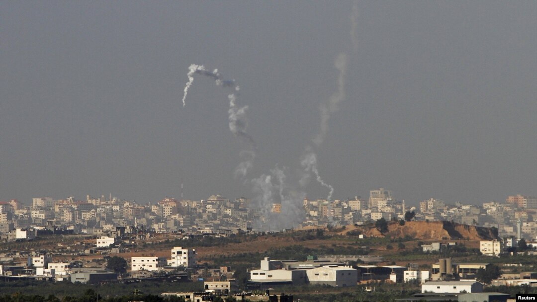 Trails of smoke are seen after the launch of rockets from the northern Gaza strip towards Israel, November 11, 2012. 