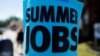 A sign advertising "Summer Jobs" hangs on a lamp post in Somerville, Massachusetts, U.S., June 15, 2016. 