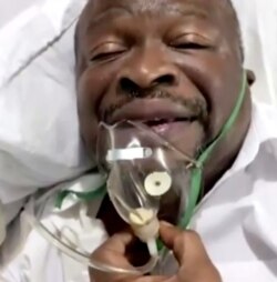 FILE - Guy Brice Parfait Kolelas speaks to supporters while receiving oxygen, in Brazzaville, Congo Republic, in this still image taken from Reuters TV video said to be filmed March 19, 2021. (Parfait Kolelas/Handout via Reuters)