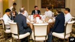 Britain's Foreign Secretary Jeremy Hunt, center, talks with government officials during a meeting on Sept. 20, 2018, in Naypyitaw, Myanmar.