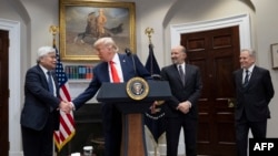 US President Donald Trump shakes the hand of C.C. Wei as he announced an investment of a $100 Billion, four-year investment into American Chip manufacturing by Taiwan’s chipmaking titan TSMC on March 3, 2025. (Photo by ROBERTO SCHMIDT / AFP)