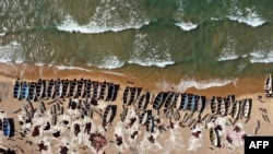 FILE - In this aerial view, fishing boats are seen on the shore of the Lake Malawi at the Senga village on May 20, 2019 in Senga, Malawi.