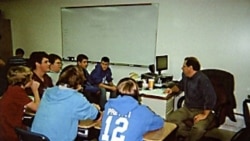 Michael Bair teaches teamwork, reading, writing, computer skills and public speaking in his ninth-grade English class for boys