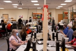 Early voting and absentee ballots are processed ahead of the upcoming presidential election in Tucson, Arizona, Oct. 31, 2020.