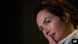 Game of Thrones star Lena Headey listens to a question during an interview with the Associated Press in Athens, June 1, 2016.