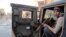 Tribal fighter sits in Humvee during joint patrol with Iraqi security forces in Ramadi, 70 miles (115 kilometers) west of Baghdad, Jan. 30, 2014.