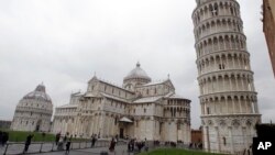 FILE - The Leaning Tower of Pisa (Torre di Pisa) is seen at right next to the medieval cathedral of Pisa, in Piazza dei Miracoli Square, in Pisa, Italy, Jan. 2, 2012.