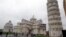 FILE - The Leaning Tower of Pisa (Torre di Pisa) is seen at right next to the medieval cathedral of Pisa, in Piazza dei Miracoli Square, in Pisa, Italy, Jan. 2, 2012.