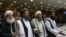 FILE - Mullah Abdul Ghani Baradar, the Taliban group's top political leader, arrives with other members of a delegation for talks in Moscow, May 28, 2019. The top Taliban negotiator says a negotiating team has been finalized for intra-Afghan negociations.