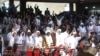 Delegates sing during a planned signing ceremony of the Sudan Founding Charter aimed at establishing a unity government involving leaders of political forces, armed groups and the Rapid Support Forces at the Kenyatta International Convention Centre in Nairob on Feb. 18, 2025. 